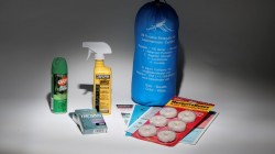 An anti Zika virus kit, including a bug net, mosquito repellent, condoms, literature and anti mosquito dunks,