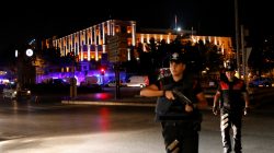 Police officers stand guard near the Turkish military headquarters in Ankara, Turkey, July 15, 2016