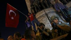 People demonstrate in front of the Republic Monument at the Taksim Square in Istanbul, Turkey, July 16,