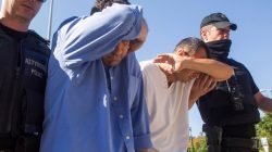 Two of the eight Turkish soldiers who fled to Greece in a helicopter and requested political asylum after a failed military coup against the government, are brought to prosecutor by two policemen in the northern Greek city of Alexandroupolis, Greece