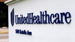 The logo of Down Jones Industrial Average stock market index listed company UnitedHealthcare is shown in Cypress, California