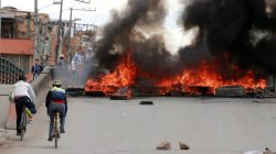 Cyclists near burning tires