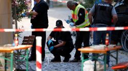 Police secure the area after an explosion in Ansbach, Germany,