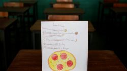 A drawing made during a lesson at a school shows what a student ate during the course of a day in Caracas, Venezuela July 14, 2016. The student wrote, "Ate corn cake with cheese for breakfast; had spaghetti with egg for lunch and a cookie for dinner." The student said that pizza was their favourite dish.
