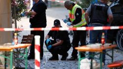 Police secure the area after an explosion in Ansbach, Germany,