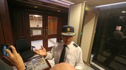 A security officer blocks the entrance to the South Korean consulate inside an office building in Hong Kong