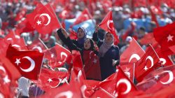 People wave Turkey's national flags during the Democracy and Martyrs Rally in Istanbul