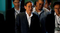 Japan's Chief Cabinet Secretary Suga arrives at Prime Minister Shinzo Abe's official residence in Tokyo