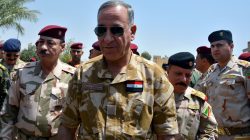 Iraqi Defence Minister Khaled al-Obeidi (C) walks during his visit to the Nineveh Liberation Operations Command at Makhmour base, south of Mosul, Iraq,