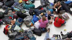 Members of the mission group Adventures In Missions wait to find out if their flight to Guatemala is on time or cancelled after Delta Air Lines' computer systems crashed on Monday, grounding flights around the globe, at Hartsfield Jackson Atlanta International Airport in Atlanta, Georgia, U.S.