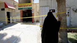 An Iraqi woman stands in front of a maternity ward after a fire broke out at Yarmouk hospital in Baghdad