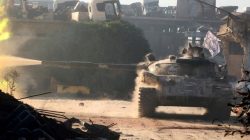A Free Syrian Army tank fires in Ramousah area, southwest of Aleppo, Syria