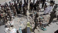 Security officials gather at the site of a bomb explosion in Quetta, Pakistan,