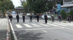 Line of police looking for bombs