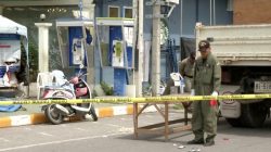 Police Explosive Ordnance Disposal (EOD) official inspects the site of a bomb blast in Hua Hin, south of Bangkok, Thailand,