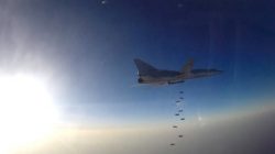 A still image, taken from video footage and released by Russia's Defence Ministry on August 16, 2016, shows a Russian Tupolev Tu-22M3 long-range bomber based in Iran dropping off bombs at an unknown location in Syria. Ministry of Defence of the Russian Federation/