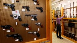 Handguns and sporting guns are displayed at Wyss Waffen gun shop in Burgdorf