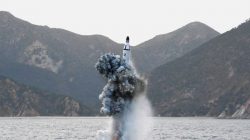 North Korean leader Kim Jong Un guides on the spot the underwater test-fire of strategic submarine ballistic missile