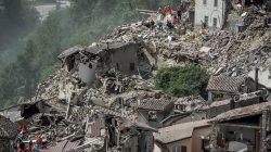 rescuers helping those in Italian quake