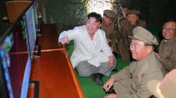 North Korean leader Kim Jong Un is pictured during a test-fire of strategic submarine-launched ballistic missile