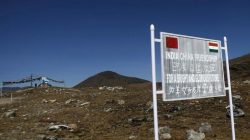 A signboard is seen from the Indian side of the Indo-China border at Bumla, in Arunachal Pradesh,