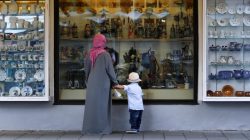 A woman wears an Islamic headdress while visiting Garmisch-Partenkirchen, Germ