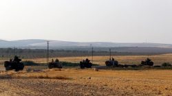Turkish armoured personnel carriers drive towards the border in Karkamis on the Turkish-Syrian border in the southeastern Gaziantep province, Turkey, August 27,
