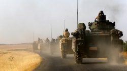 Turkish armoured personnel carriers drive towards the border in Karkamis on the Turkish-Syrian border in the southeastern Gaziantep province, Turkey,