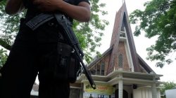 Police are seen outside Saint Joseph's Catholic Church after a suspected terror attack by a knife-wielding assailant on a priest during Sunday service in Medan, North Sumatra, Indonesia August 28, 2016 in this photo taken by Antara Foto. Picture taken Augu