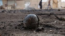 A file photo shows an unexploded cluster bomblet along a street after airstrikes by pro-Syrian government forces in the rebel held al-Ghariyah al-Gharbiyah town,