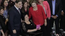 Brazil's President Rousseff poses with women's rights activist Maria da Penha during the launch of the "Woman: Living without Violence" program in Brasilia