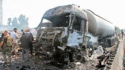 Syrian army soldiers inspect the damage at the site of two explosions that hit the Arzouna bridge area at the entrance to Tartous, Syria