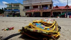 A school bag lies on a street next to the site of a bomb attack at Tak Bai district in the troubled southern province of Narathiwat
