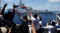 Chinese Coast Guard vessel manoeuvres to block a Philippine government supply ship with members of media aboard at disputed Second Thomas Shoal in South China Sea