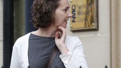 Pauline Cafferkey a nurse who volunteered volunteered to treat Ebola patients in West Africa, then survived the disease herself, leaves a hearing after being cleared of misconduct charges in Edinburgh, Scotland