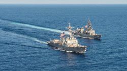 Arleigh Burke-class guided-missile destroyer USS Mustin (DDG 89) transits in formation with Japan Maritime Self-Defense Force ship JS Kirisame (DD 104) during bilateral training in South China Sea