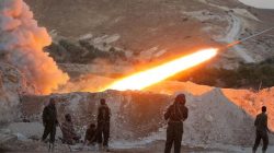 Free Syrian Army fighters launch a Grad rocket from Halfaya town in Hama province, towards forces loyal to Syria's President Bashar al-Assad stationed in Zein al-Abidin mountain,