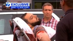 A still image captured from a video from WABC television shows a conscious man believed to be New York bombing suspect Ahmad Khan Rahami being loaded into an ambulance after a shoot-out with police in New Jersey