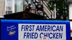Federal Bureau of Investigation (FBI) personnel search an address during an investigation into Ahmad Khan Rahami, who was wanted for questioning in an explosion in New York, which authorities believe is linked to the explosive devices found in New Jersey