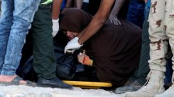 An Egyptian mother reacts beside the body of her son who was on a boat carrying migrants which capsized off Egypt's coast, in Al-Beheira, Egypt, September 22, 2016.