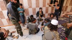 Rebel fighters of 'Al-Sultan Murad' brigade gather on the outskirts of the northern Syrian town of Shawa, which is controlled by Islamic State militants, in Aleppo Governorate, Syria,