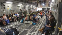 Families aboard a plane to evacuate them