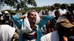 A man mourns during the funeral of Tesfu Tadese Biru, 32, a construction engineer who died during a stampede after police fired warning shots at an anti-government protest in Bishoftu during Irreecha, the thanksgiving festival of the Oromo people, in Denkaka Kebele