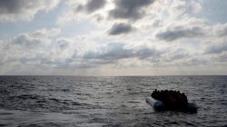 Migrants in a dinghy await rescue around 20 nautical miles off the coast of Libya,