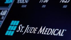 The ticker and trading information for St. Jude Medical is displayed where the stock is traded on the floor of the New York Stock Exchange (NYSE) in New York City, U.S