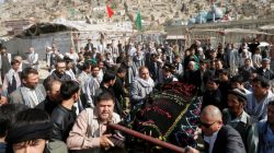 Afghan Shi'ite Muslims carry the coffin of one of the victims of Tuesday's attack for burial at the Sakhi Shrine in Kabul, Afghanistan