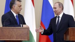Russian President Vladimir Putin (R) and Hungarian Prime Minister Viktor Orban shake hands during a joint news conference following their talks at the Novo-Ogaryovo state residence outside Moscow, Russia,