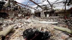A hole is seen during a visit by human rights activists to a community hall that was struck by an airstrike during a funeral on October 8, in Sanaa, Yemen,
