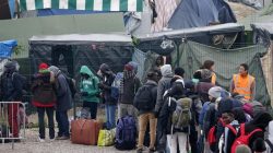 Migrants/refugees with their belongings during evacuation