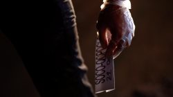 Police holding a tag for a man who was killed by a gunman